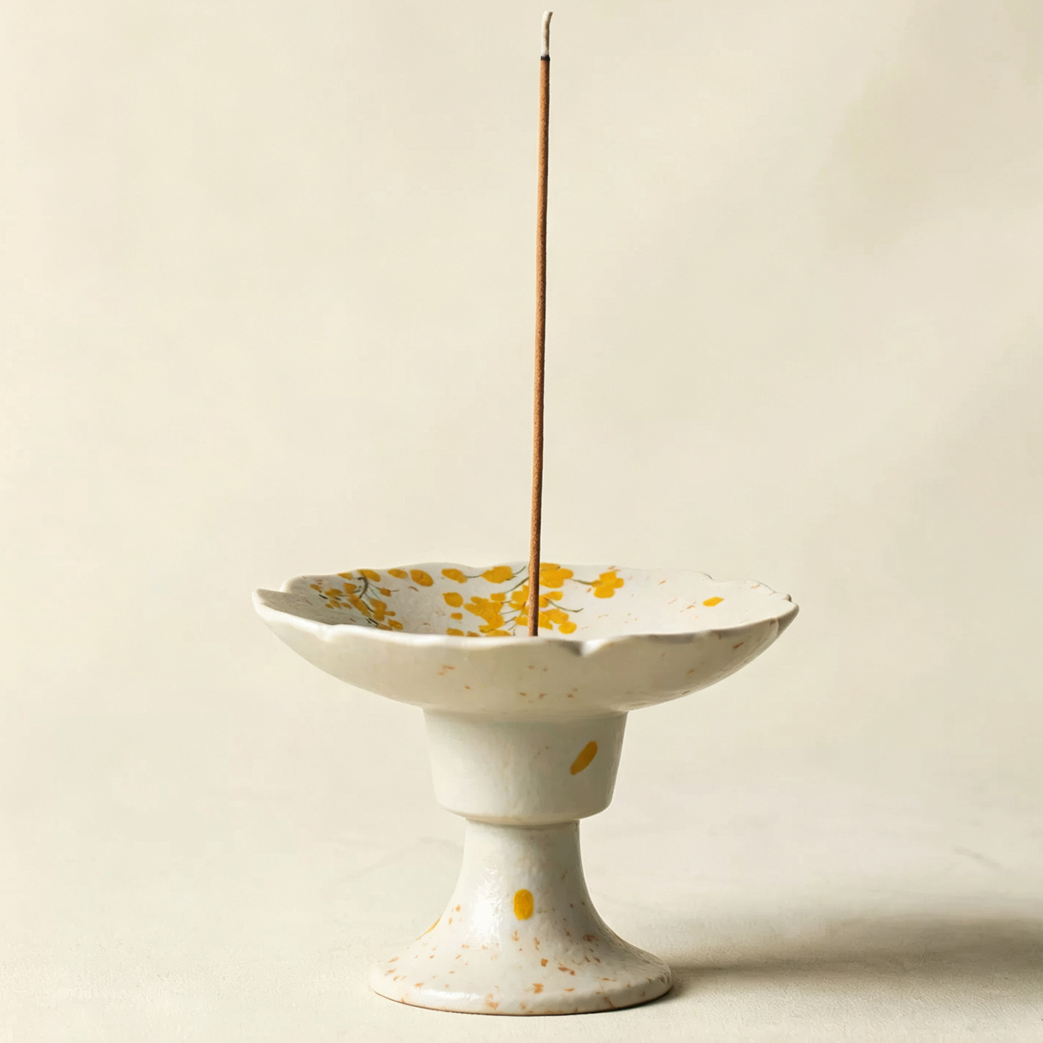 Elevated pedestal rapeseed ceramic incense burner with scalloped flared tray
